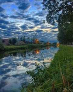 A picturesque canal in the Dutch countryside, ideal for Facebook advertising.