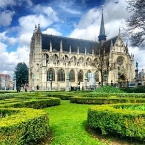 An ornate cathedral with a garden in front of it, now featuring advertising on Facebook.